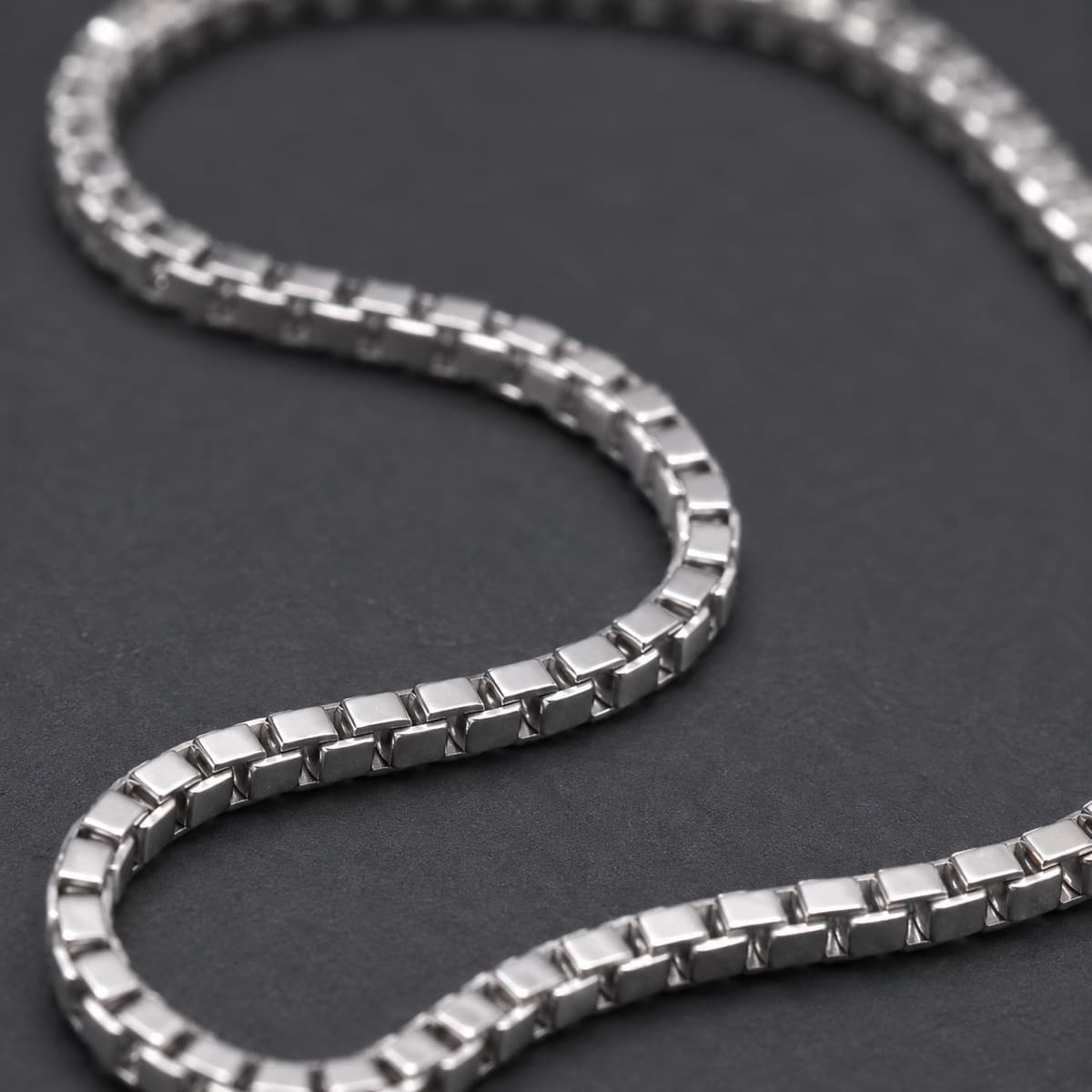 Box Chain 1.2 mm in solid 925 sterling silver, photographed against a dark grey background